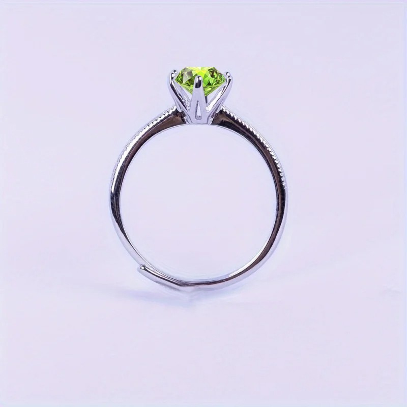 Anillo de compromiso en plata detalle de borde efecto perlado con peridoto